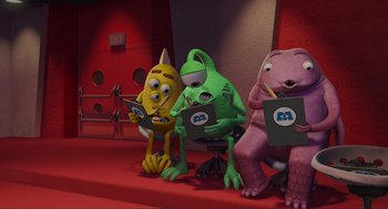 Movie still from “Monsters, Inc.” (2001), directed by Pete Docter – A group of cartoon characters sitting next to each other; Medium shot, Low angle