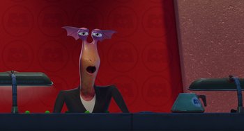 Movie still from “Monsters, Inc.” (2001), directed by Pete Docter – An animated character is sitting at a desk; Close Up shot, Over the shoulder angle