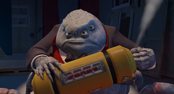 Movie still from “Monsters, Inc.” (2001), directed by Pete Docter – An image of an animated character holding an object; Medium shot, Low angle