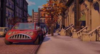 Movie still from “Monsters, Inc.” (2001), directed by Pete Docter – An animated scene of a street with a red car and a tree; Extreme Wide shot, High angle
