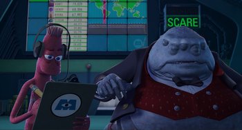 Movie still from “Monsters, Inc.” (2001), directed by Pete Docter – An image of an animated character in a computer room; Medium shot, Low angle