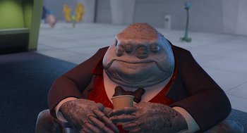 Movie still from “Monsters, Inc.” (2001), directed by Pete Docter – An image of an animated character holding a cup of hot chocolate; Medium shot, High angle