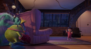Movie still from “Monsters, Inc.” (2001), directed by Pete Docter – A purple chair in a living room next to a window; Wide shot, High angle