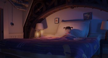 Movie still from “Monsters, Inc.” (2001), directed by Pete Docter – A little girl laying in a bed in a room; Wide shot, High angle