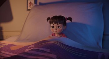 Movie still from “Monsters, Inc.” (2001), directed by Pete Docter – A little girl laying in a bed looking sad; Medium shot, High angle