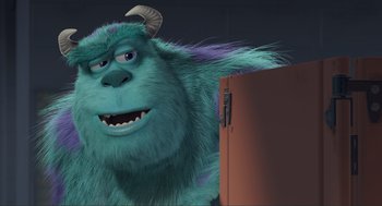 Movie still from “Monsters, Inc.” (2001), directed by Pete Docter – A monster with horns standing next to an open refrigerator; Medium shot, Low angle