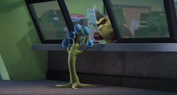 Movie still from “Monsters, Inc.” (2001), directed by Pete Docter – An image of an animated character looking out of a window; Medium shot, Over the shoulder angle