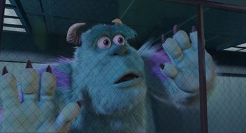 Movie still from “Monsters, Inc.” (2001), directed by Pete Docter – A stuffed animal behind a fence; Medium shot, Low angle