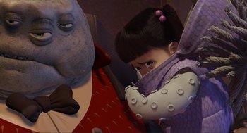 Movie still from “Monsters, Inc.” (2001), directed by Pete Docter – A little girl holding onto a stuffed elephant; Medium shot, Over the shoulder angle