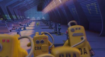 Movie still from “Monsters, Inc.” (2001), directed by Pete Docter – A room filled with lots and lots of yellow equipment; Extreme Wide shot, High angle