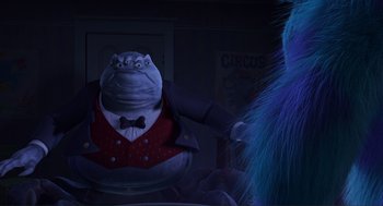 Movie still from “Monsters, Inc.” (2001), directed by Pete Docter – A person in a suit and tie; Medium shot, Over the shoulder angle
