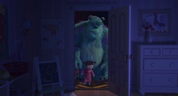 Movie still from “Monsters, Inc.” (2001), directed by Pete Docter – A little girl standing in front of a monster in a room; Wide shot, Over the shoulder angle