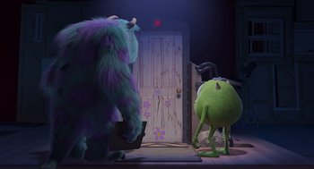 Movie still from “Monsters, Inc.” (2001), directed by Pete Docter – Two monsters university characters in front of a door; Wide shot, Over the shoulder angle