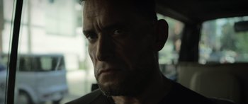 Movie still from “Monsters of Man” (2020), directed by Mark Toia – A person with a beard looking into the distance; Close Up shot, Low angle