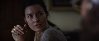 Movie still from “Monsters of Man” (2020), directed by Mark Toia – A person sitting in front of a window; Close Up shot, Over the shoulder angle