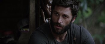 Movie still from “Monsters of Man” (2020), directed by Mark Toia – A person with a beard looking at the camera; Close Up shot, Over the shoulder angle