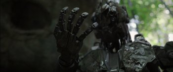 Movie still from “Monsters of Man” (2020), directed by Mark Toia – A robotic hand in a dark setting; Close Up shot, Low angle