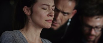 Movie still from “Monsters of Man” (2020), directed by Mark Toia – A man and a woman looking at each other with their eyes wide open; Close Up shot, Over the shoulder angle