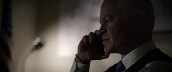 Movie still from “Monsters of Man” (2020), directed by Mark Toia – A person talking on a cell phone; Close Up shot, Low angle