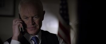 Movie still from “Monsters of Man” (2020), directed by Mark Toia – An older man in a vest and a tie; Close Up shot, Low angle