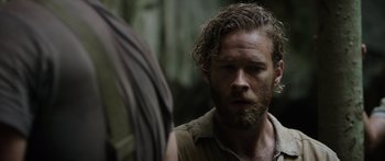 Movie still from “Monsters of Man” (2020), directed by Mark Toia – A man with a beard is looking into a mirror; Close Up shot, Over the shoulder angle