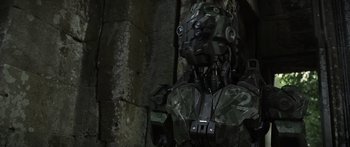 Movie still from “Monsters of Man” (2020), directed by Mark Toia – The head of an artificial robot; Medium shot, Low angle