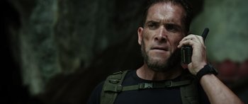 Movie still from “Monsters of Man” (2020), directed by Mark Toia – A person wearing a black t - shirt; Close Up shot, Low angle