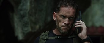 Movie still from “Monsters of Man” (2020), directed by Mark Toia – A person wearing a black shirt; Close Up shot, Low angle