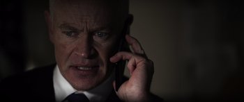 Movie still from “Monsters of Man” (2020), directed by Mark Toia – A person talking on a cell phone; Close Up shot, Low angle