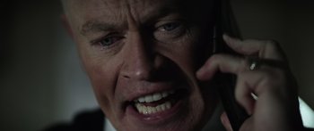 Movie still from “Monsters of Man” (2020), directed by Mark Toia – An older man is on his cell phone; Extreme Close Up shot, High angle