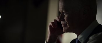 Movie still from “Monsters of Man” (2020), directed by Mark Toia – An older man talking on a cell phone; Close Up shot, Over the shoulder angle