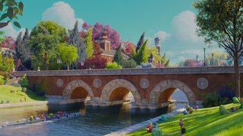 Movie still from “Monsters University” (2013), directed by Dan Scanlon – A bridge over a body of water near a park; Extreme Wide shot, High angle