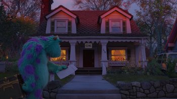 Movie still from “Monsters University” (2013), directed by Dan Scanlon – A monster holding a piece of paper in front of a house; Extreme Wide shot, Low angle