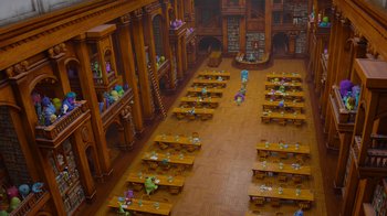 Movie still from “Monsters University” (2013), directed by Dan Scanlon – A room filled with lots of wooden tables and chairs; Extreme Wide shot, High angle