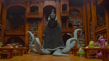 Movie still from “Monsters University” (2013), directed by Dan Scanlon – An octopus statue in the middle of a library; Extreme Wide shot, Low angle