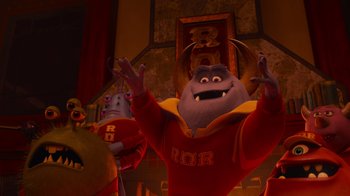 Movie still from “Monsters University” (2013), directed by Dan Scanlon – A group of people standing next to each other in a room; Medium shot, Low angle