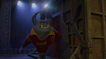 Movie still from “Monsters University” (2013), directed by Dan Scanlon – A cartoon character is standing in the dark; Wide shot, Low angle