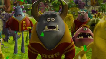 Movie still from “Monsters University” (2013), directed by Dan Scanlon – A group of people that are standing in the grass; Medium shot, High angle
