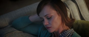 Movie still from “Monstrous” (2022), directed by Chris Sivertson – A person laying on the ground; Close Up shot, High angle