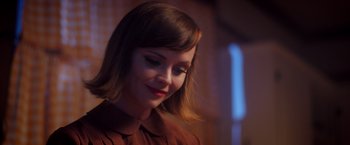 Movie still from “Monstrous” (2022), directed by Chris Sivertson – A person with short hair; Close Up shot, Over the shoulder angle