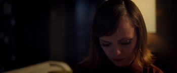 Movie still from “Monstrous” (2022), directed by Chris Sivertson – A person looking down at something; Close Up shot, High angle