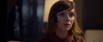 Movie still from “Monstrous” (2022), directed by Chris Sivertson – A person with short hair; Close Up shot, Over the shoulder angle