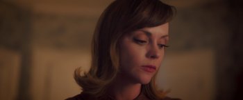 Movie still from “Monstrous” (2022), directed by Chris Sivertson – A person wearing a brown shirt; Close Up shot, Low angle