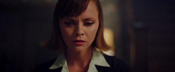 Movie still from “Monstrous” (2022), directed by Chris Sivertson – A person with short hair; Close Up shot, Low angle