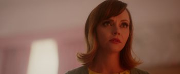 Movie still from “Monstrous” (2022), directed by Chris Sivertson – A person with short brown hair; Close Up shot, Low angle