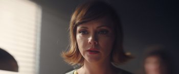 Movie still from “Monstrous” (2022), directed by Chris Sivertson – A person with short hair; Close Up shot, High angle