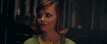Movie still from “Monstrous” (2022), directed by Chris Sivertson – A person with short hair; Close Up shot, Over the shoulder angle