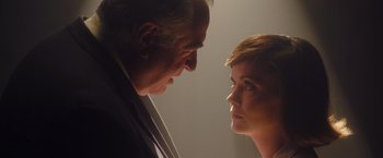 Movie still from “Monstrous” (2022), directed by Chris Sivertson – A man and a woman face to face in a room; Close Up shot, Low angle