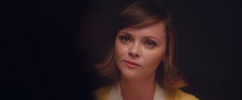 Movie still from “Monstrous” (2022), directed by Chris Sivertson – A person with short brown hair; Close Up shot, Over the shoulder angle