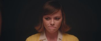Movie still from “Monstrous” (2022), directed by Chris Sivertson – A person with her eyes closed; Close Up shot, Over the shoulder angle